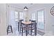 Kitchen dining area with a wooden table and four black chairs at 5921 Marshbank Ln, Charlotte, NC 28269