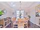 Elegant dining room with a large wooden table and chandelier at 5921 Marshbank Ln, Charlotte, NC 28269