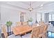 Spacious dining room with a large table and access to kitchen at 5921 Marshbank Ln, Charlotte, NC 28269