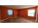 Bright bedroom with orange walls and carpet flooring at 6127 Meadow Rose Ln, Charlotte, NC 28215