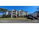 Three-story condo building with multiple units and balconies at 6127 Meadow Rose Ln, Charlotte, NC 28215