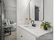 Modern bathroom with white vanity, quartz countertop, and black matte fixtures at 6706 Queensberry Dr, Charlotte, NC 28226