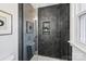 Sleek shower with dark hexagon tiles and a frameless glass enclosure at 6706 Queensberry Dr, Charlotte, NC 28226