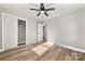 Spacious bedroom with hardwood floors, a closet, and ceiling fan at 6762 Glenmoor Dr, Charlotte, NC 28214