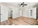 Well-lit bedroom with hardwood floors and a spacious closet at 6762 Glenmoor Dr, Charlotte, NC 28214