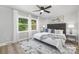 Bright bedroom with a king-size bed and large windows at 6762 Glenmoor Dr, Charlotte, NC 28214