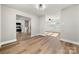 Light-filled dining area with hardwood floors and kitchen views at 6762 Glenmoor Dr, Charlotte, NC 28214