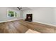 Living room featuring hardwood floors, fireplace, and natural light at 6762 Glenmoor Dr, Charlotte, NC 28214