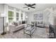 Spacious living room with light gray walls and large windows at 6762 Glenmoor Dr, Charlotte, NC 28214