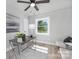 Home office with a desk, window, and light gray walls at 6762 Glenmoor Dr, Charlotte, NC 28214