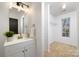 Modern bathroom with updated vanity and closet at 7010 Sycamore Grove Ct, Charlotte, NC 28227