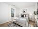 Charming bedroom with a neutral color palette, comfortable bed, and window at 7010 Sycamore Grove Ct, Charlotte, NC 28227