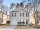 Two-story house with vinyl siding, attached garage, and landscaping at 7010 Sycamore Grove Ct, Charlotte, NC 28227