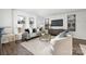 Bright living room featuring a gray sofa and stylish coffee table at 7010 Sycamore Grove Ct, Charlotte, NC 28227