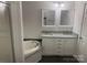 Main bathroom with double vanity and soaking tub at 7104 Sandy Smith Rd, Marshville, NC 28103