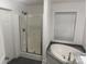 Bathroom with soaking tub and shower at 7104 Sandy Smith Rd, Marshville, NC 28103