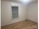 Bedroom with hardwood floors and window at 7104 Sandy Smith Rd, Marshville, NC 28103