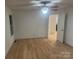 Bedroom with hardwood floors and door to hallway at 7104 Sandy Smith Rd, Marshville, NC 28103