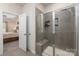 Bathroom with a walk-in shower and view of a bedroom at 7163 Yardley St, Gastonia, NC 28056