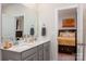 Bathroom with double vanity and view of a bedroom at 7163 Yardley St, Gastonia, NC 28056