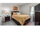 Cozy bedroom with a full-size bed, dresser, and nightstand at 7163 Yardley St, Gastonia, NC 28056