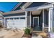 Front entry and garage with gray siding at 7163 Yardley St, Gastonia, NC 28056