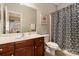 Clean bathroom with a single sink vanity and shower/tub combo at 819 Lillieshall Rd, Waxhaw, NC 28173