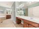 Elegant bathroom with double vanity and a large soaking tub at 819 Lillieshall Rd, Waxhaw, NC 28173