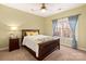 Cozy bedroom with wood framed bed and window overlooking the woods at 819 Lillieshall Rd, Waxhaw, NC 28173