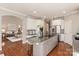 Modern kitchen with granite countertops, stainless steel appliances, and an island at 819 Lillieshall Rd, Waxhaw, NC 28173