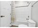 Clean bathroom with tub shower and white tile at 8243 Bretton Woods Dr, Charlotte, NC 28227