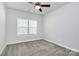 Bright bedroom with gray carpet and ceiling fan at 8243 Bretton Woods Dr, Charlotte, NC 28227