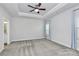 Bright bedroom with ceiling fan, carpet flooring and walk-in closet at 8243 Bretton Woods Dr, Charlotte, NC 28227