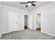 Bedroom with ceiling fan and access to bathroom at 8243 Bretton Woods Dr, Charlotte, NC 28227