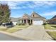 Attractive brick home with a two-car garage and manicured lawn at 8243 Bretton Woods Dr, Charlotte, NC 28227