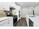 Modern kitchen featuring white cabinets, stainless steel appliances, and quartz countertops at 8243 Bretton Woods Dr, Charlotte, NC 28227