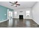 Living room with hardwood floors, fireplace, and access to backyard at 8243 Bretton Woods Dr, Charlotte, NC 28227