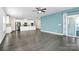 Spacious living room with hardwood floors, fireplace, and access to balcony at 8243 Bretton Woods Dr, Charlotte, NC 28227