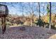 Backyard with fire pit and wooded view at 835 Belmont Ave, Charlotte, NC 28205