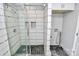 Modern bathroom with a large walk-in shower and laundry area at 835 Belmont Ave, Charlotte, NC 28205