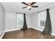 Bright bedroom with wood floors, ceiling fan, and ample window light at 835 Belmont Ave, Charlotte, NC 28205