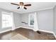 Bright bedroom with hardwood floors, neutral walls and two windows at 835 Belmont Ave, Charlotte, NC 28205