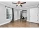 Bedroom with mirrored closet doors and ceiling fan at 835 Belmont Ave, Charlotte, NC 28205