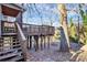 Elevated deck with stairs and wooded view at 835 Belmont Ave, Charlotte, NC 28205