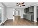 Open dining area with gray cabinets and hardwood floors at 835 Belmont Ave, Charlotte, NC 28205