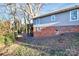 Side view of gray house with brick foundation at 835 Belmont Ave, Charlotte, NC 28205