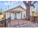 Gray house exterior with a deck and large tree at 835 Belmont Ave, Charlotte, NC 28205