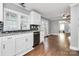 Modern kitchen with white cabinets, granite counters, and stainless steel appliances at 835 Belmont Ave, Charlotte, NC 28205