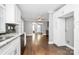 Modern kitchen with white cabinets, granite counters, and stainless steel appliances at 835 Belmont Ave, Charlotte, NC 28205