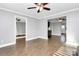 Open floorplan living room with hardwood floors and access to bedrooms at 835 Belmont Ave, Charlotte, NC 28205